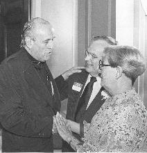 Fr. Robert Drinan with Mr. and Mrs. Moss